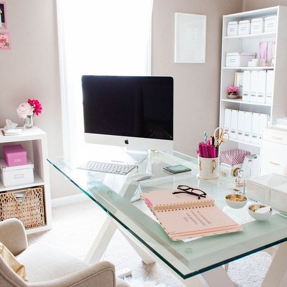 white wooden trestle legs and a glass tabletop for a cute modern girlish home office