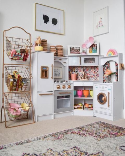 a play kitchen nook as a part of a playroom