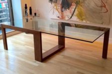 08 modern sculptural table with a creative geo wooden frame and a large glass table top