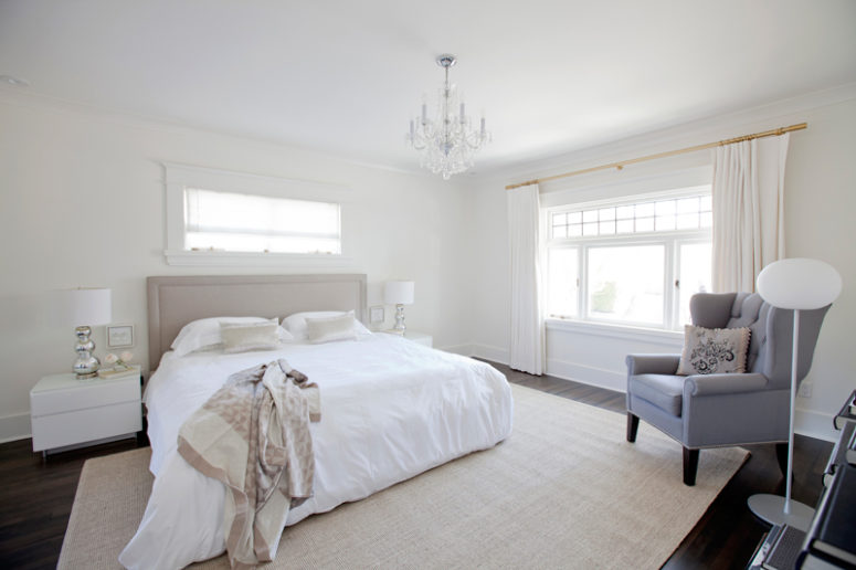 The master bedroom is filled with neutrals and soft textiles, which make it welcoming