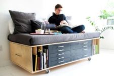 09 a daybed or sofa with storage drawers and open shelves for a small home