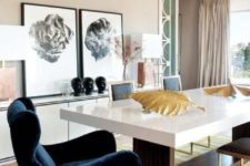 09 a mid-century modern dining space in neutrals with yellow accents and a chic comfy navy velvet armchair