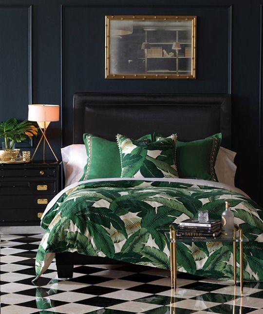 Tropical leaf print bedding is a budget friendly way to spruce up the bedroom