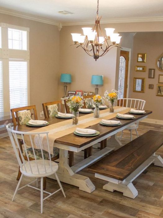 a rustic dining space with a wooden tabletop and white legs and a matching bench looks cozy and intimate