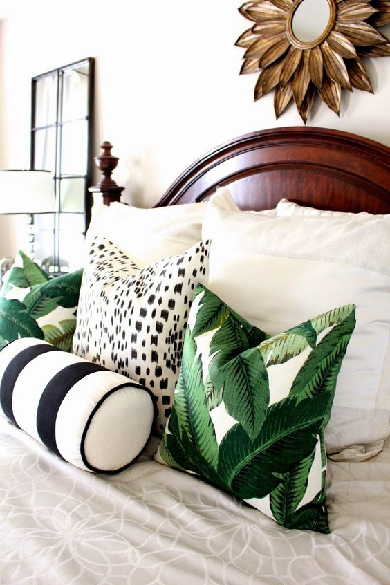 tropical leaf print pillows will spruce up your bedroom and make it summery