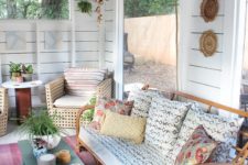 12 a rustic and vintage living room with panoramic windows, rattan furniture and boho decorations