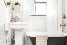 12 a white vintage-inspired bathroom with patterned black and white floor tiles