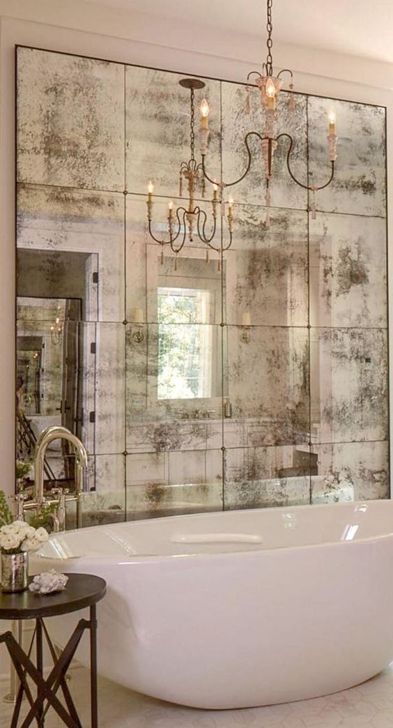 an artfully faded mirror is all that is necessary to create a vintage feeling at home