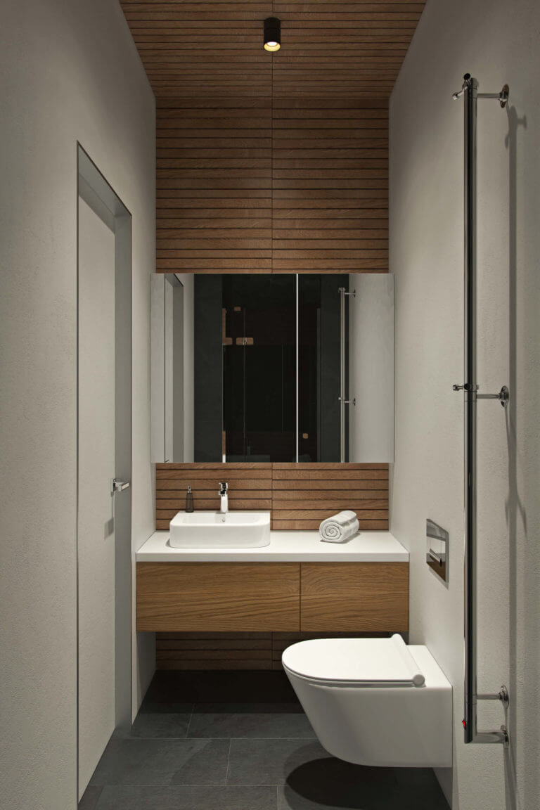 The second bathroom is done in light grey and with the use of natural wood