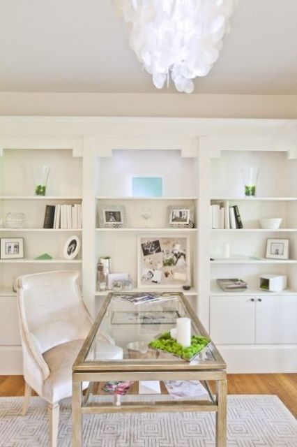 a glass desk with a double tabletop and wooden framing - such a smart storage idea
