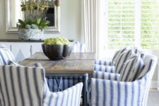 13 a traditional cottage dining room with blue and white striped armchairs for comfort and chic