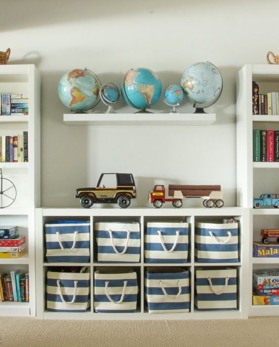 insert fabric boxes into an open shelving cabinet to declutter the space