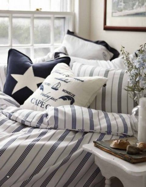 a nautical bedding set with stripes, stars and nautical prints