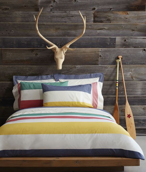bring summer vibes to your bedroom with colorful striped bedding