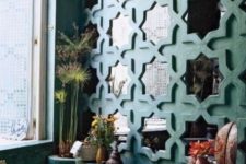 16 repeated wall mirrors in eye-catchy frames to fit a Moroccan bathroom