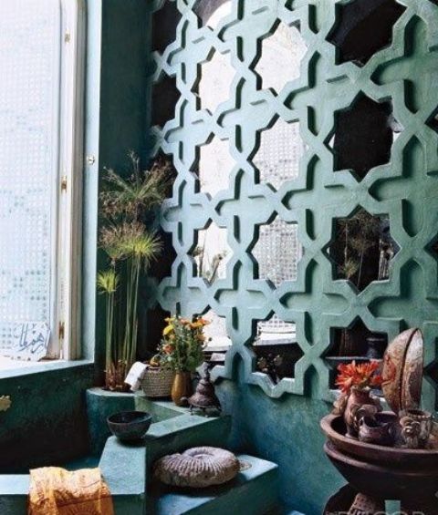 repeated wall mirrors in eye-catchy frames to fit a Moroccan bathroom
