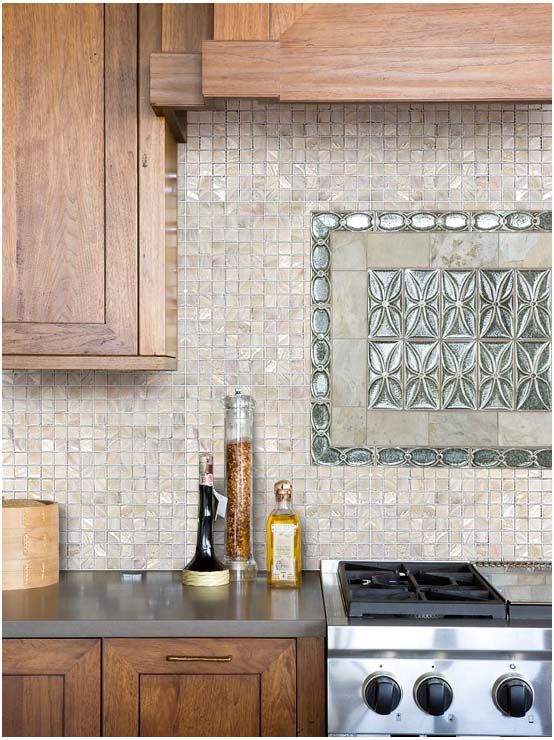 Warm stained wooden cabinets look organic and natural with mother of pearl tile backsplash