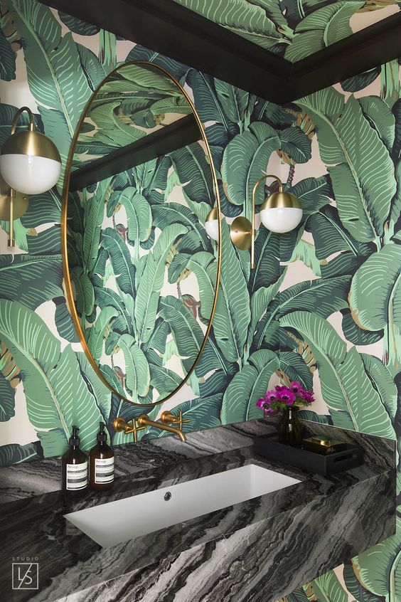 using palm leaf printed wallpaper in a powder room will make it amazing and refined