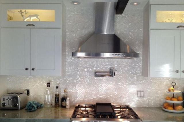 add a glam touch to your kitchen with a gorgeous mother of pearl tile backsplash