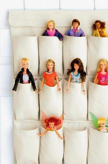 a pocket doll storage attached to the wall is great for a girl's playroom