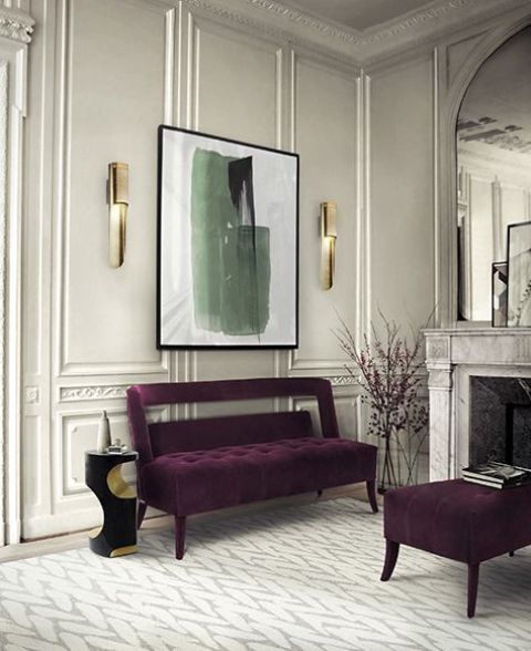 chic refined space with a deep purple bench and ottoman to add color