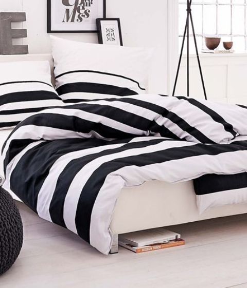 wide black and white striped bedding for a modern and laconic bedroom