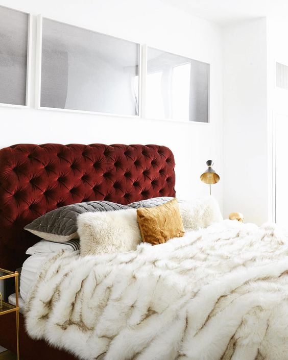 a burgundy velvet upholstered headboard for a luxurious touch in your bedroom