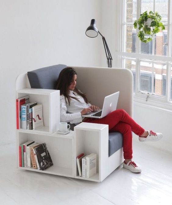 a comfy upholstered chair with built-in bookshelves is ideal for any book lover