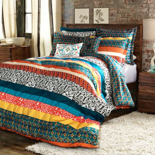 colorful patchwork striped bedding for a rustic, woodland or boho bedroom