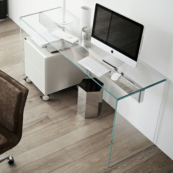 ultra-minimalist home office with a clear glass desk looks disappearing in the air