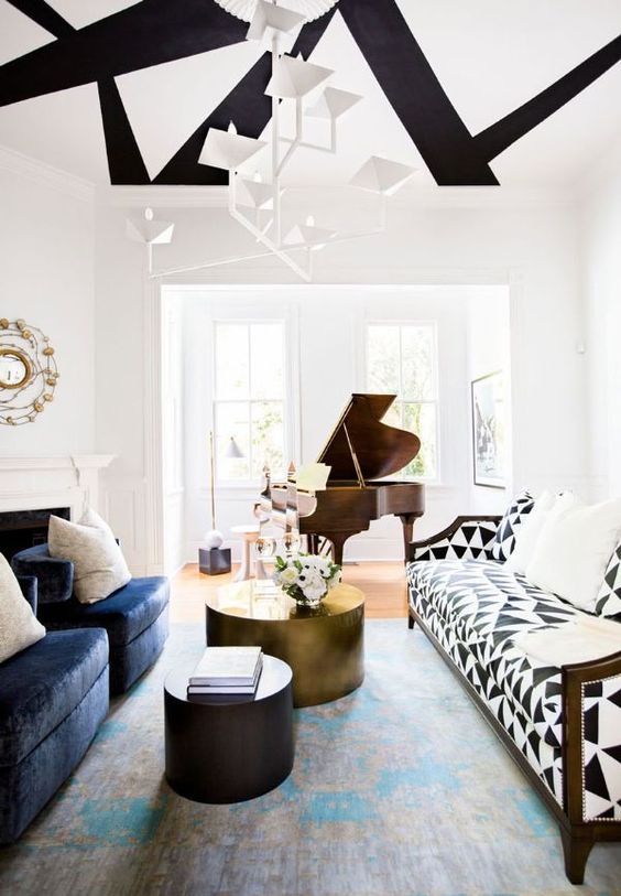 Whimsy modern space with a black and white triangle sofa to make a statement