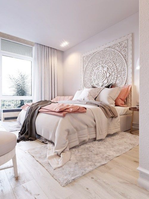 A unique mandala inspired textural art piece makes a statement in this bedroom