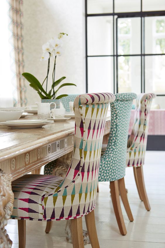 colorful rhomb and triangle upholstered sofa for a boo touch in the dining room