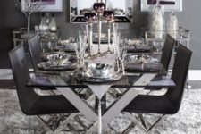 23 a chic table with criss cross metal legs and matching chairs in black for a dramatic dining space
