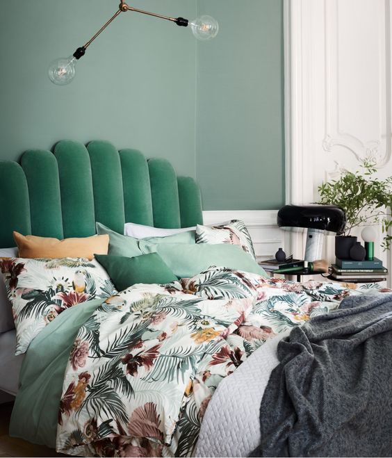 a green emerald upholstered headboard for a modern bedroom