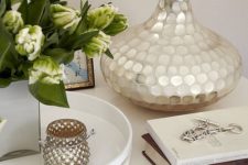 23 a lamp base is covered with mother of pearl and will be a great fit for an exquisite or glam space