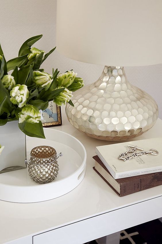 A lamp base is covered with mother of pearl and will be a great fit for an exquisite or glam space