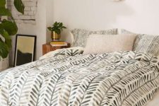 23 boho and mid-century modern bedding with a muted green botanical print