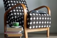 24 a black and white large circle upholstered chair with a wooden frame looks modern and chic