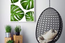 24 a colorful monstera leaf wall art echoes with the greenery below