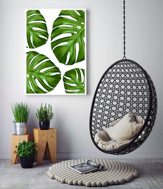 a colorful monstera leaf wall art echoes with the greenery below