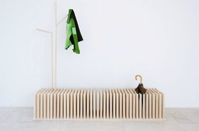 a creative entryway bench with storage in between beams is a cool modern idea