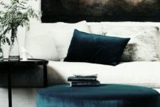 24 a navy ottoman and a pillow won’t break the bank but will make your space fashionable and luxurious