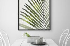 25 a framed palm leaf print for a Scandinavian dining room