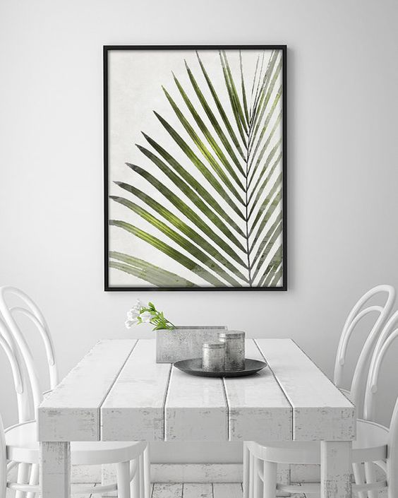 a framed palm leaf print for a Scandinavian dining room