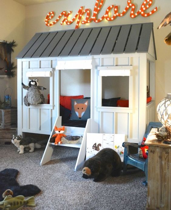 A tree house in a playroom is always a win win idea, which also helps to divide zones