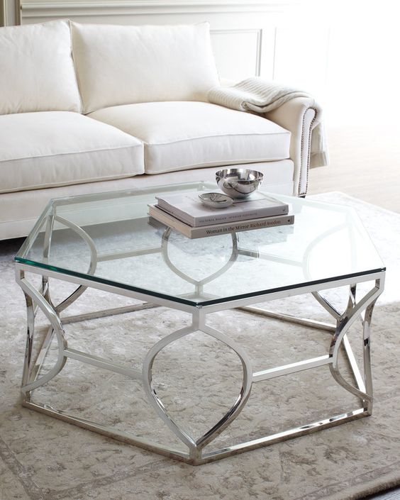 an art deco inspired coffee table with a polished geo base and a hexagon tabletop to add chic to your space