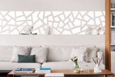 26 a modern geo mirror wall decal over the sofa for a modern feel