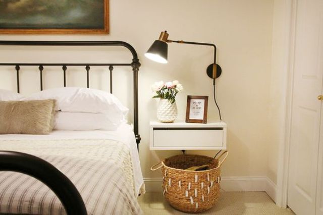 a simple white drawer nightstand looks very airy and doesn't make the room look bulky