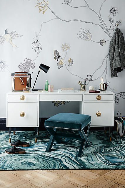 a teal stool and printed rug of velvet for a girlish home office